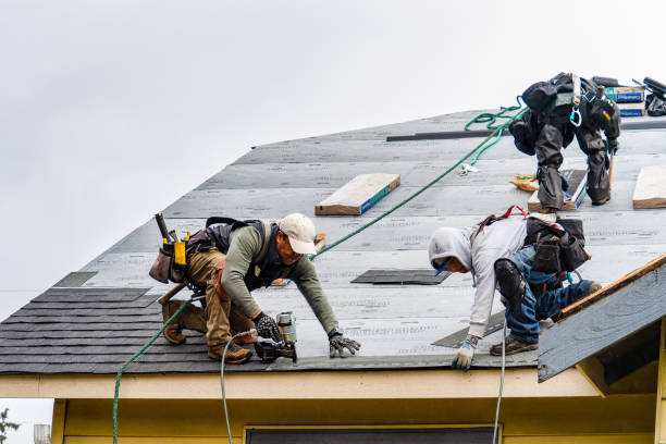 Professional Gutter Installation technician working in North Reading, MA